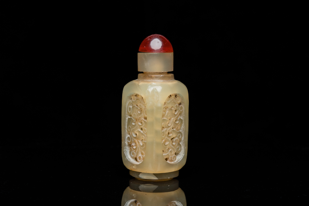 A Chinese reticulated and movable celadon jade snuff bottle, Qing