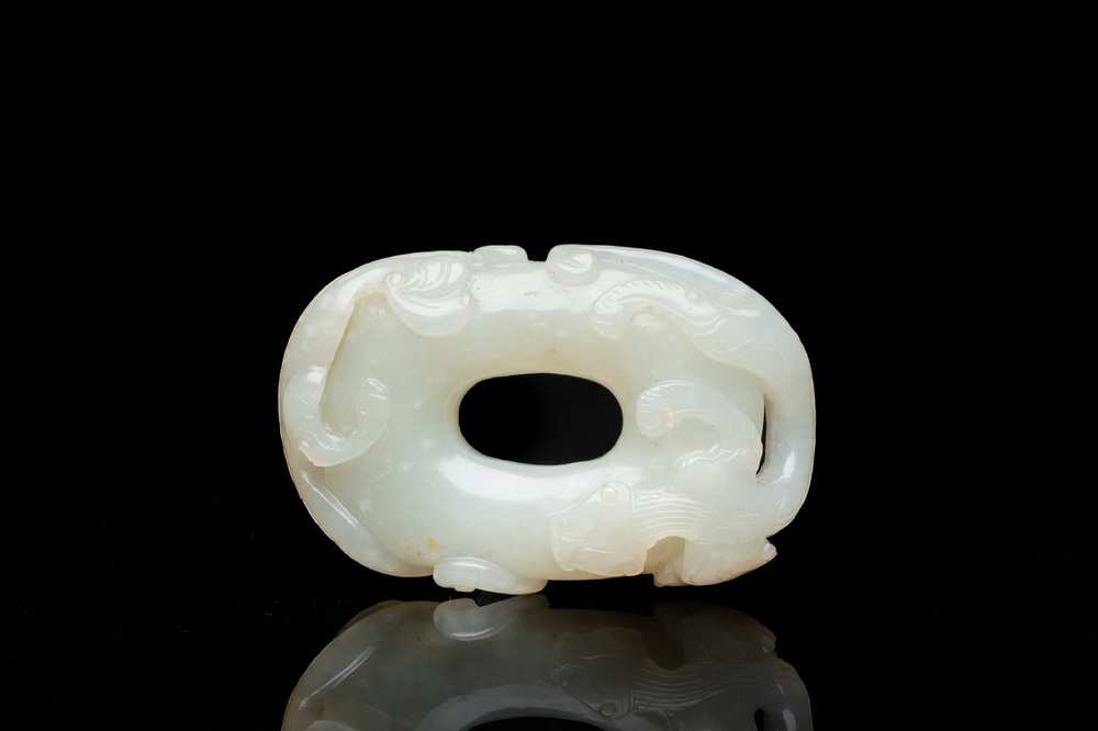 A Chinese 'twin chilong&rsquo; white jade circular pendant, Qing