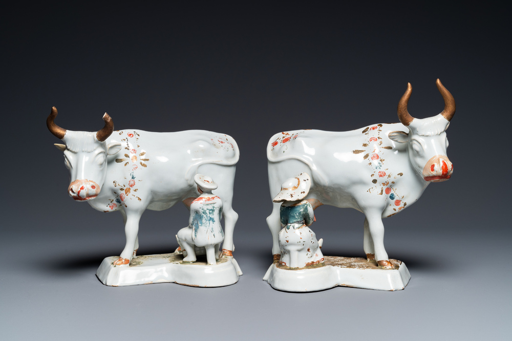 A pair of cold-painted white Dutch Delft cow milkers' groups, 18th C.
