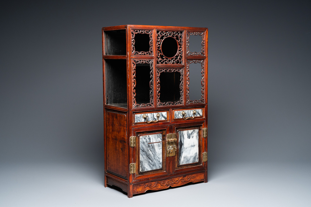 A small Chinese open-worked carved wooden cabinet with marble insets, 19th C.