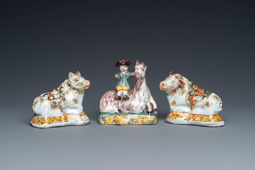 Three polychrome and cold-painted Dutch Delft miniatures of a buckrider and two cows, 18th C.