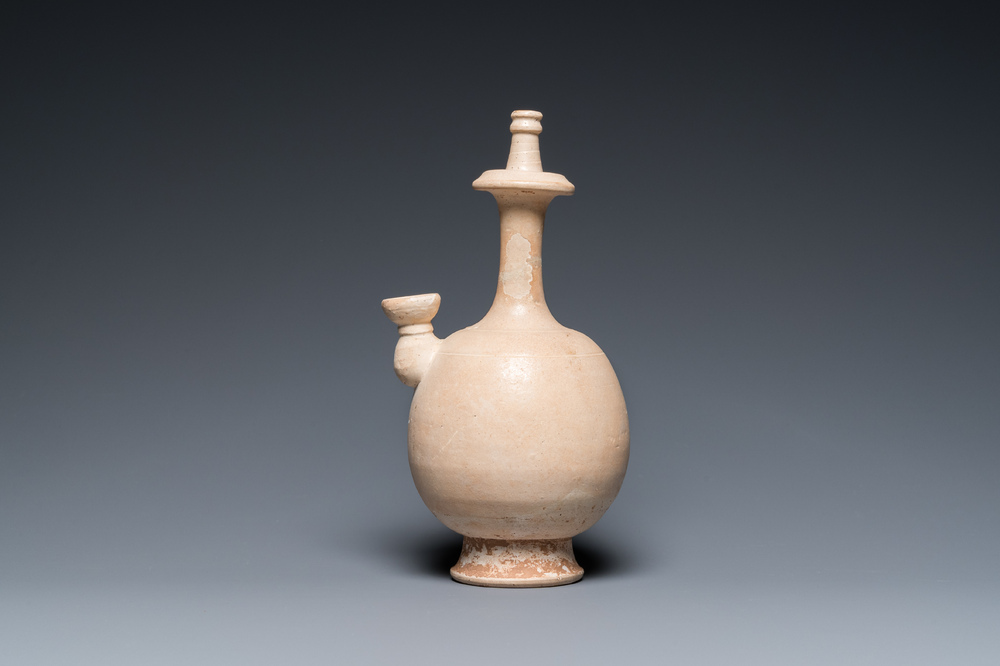 A Chinese cream-white-glazed stoneware kundika, probably Tang