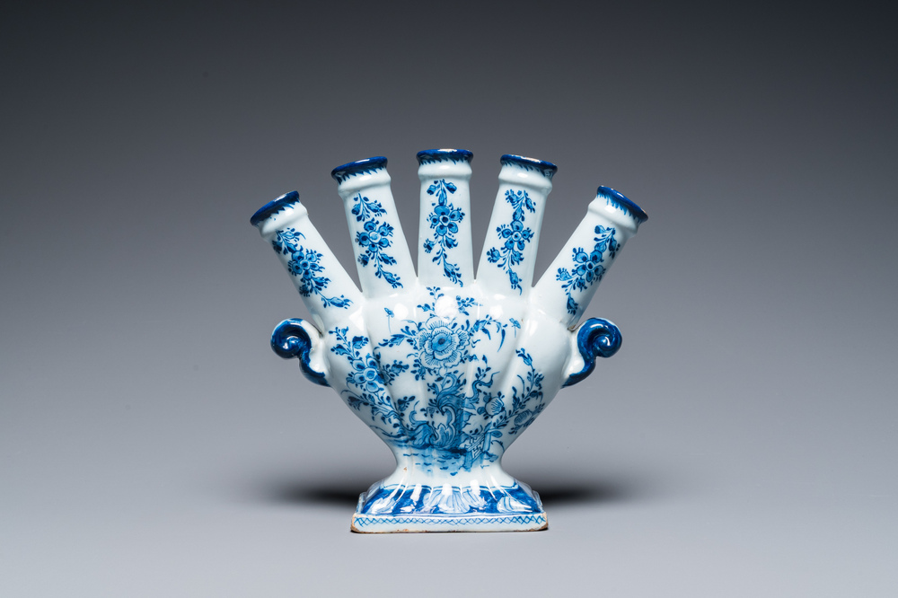 A Dutch Delft blue and white tulip vase with floral design, 18th C.