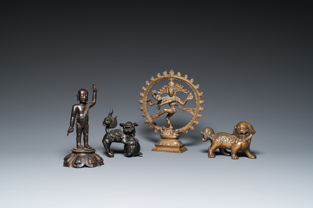 Two Chinese bronze Buddhist lions and a standing infant Buddha, Ming and later