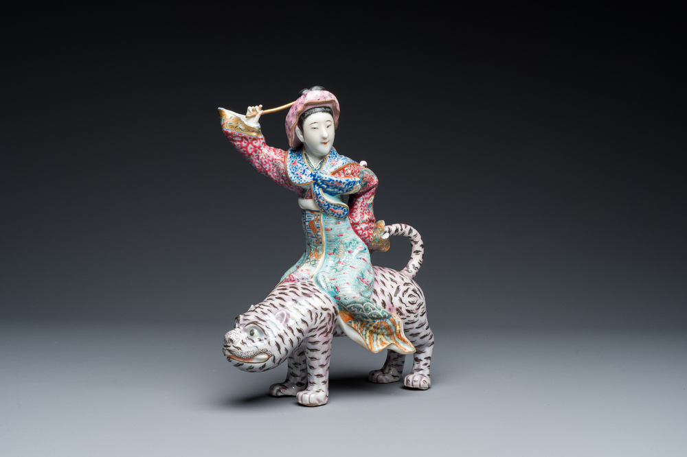 A Chinese famille rose group with a tiger and his rider, 19/20th C.