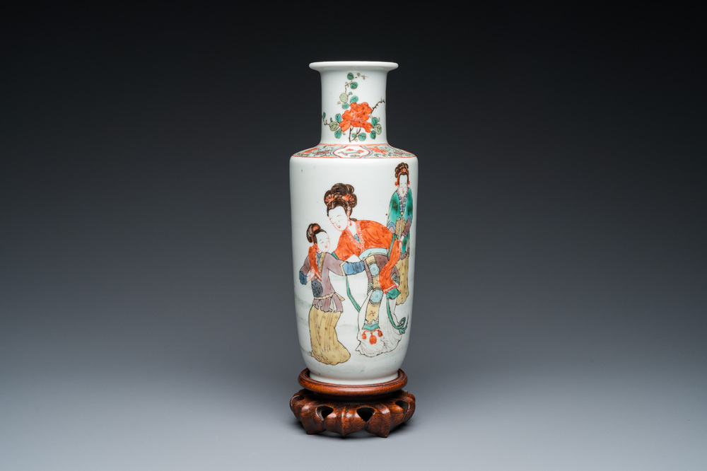 A Chinese famille verte rouleau vase on wooden 'lotus' stand, probably 19th C.