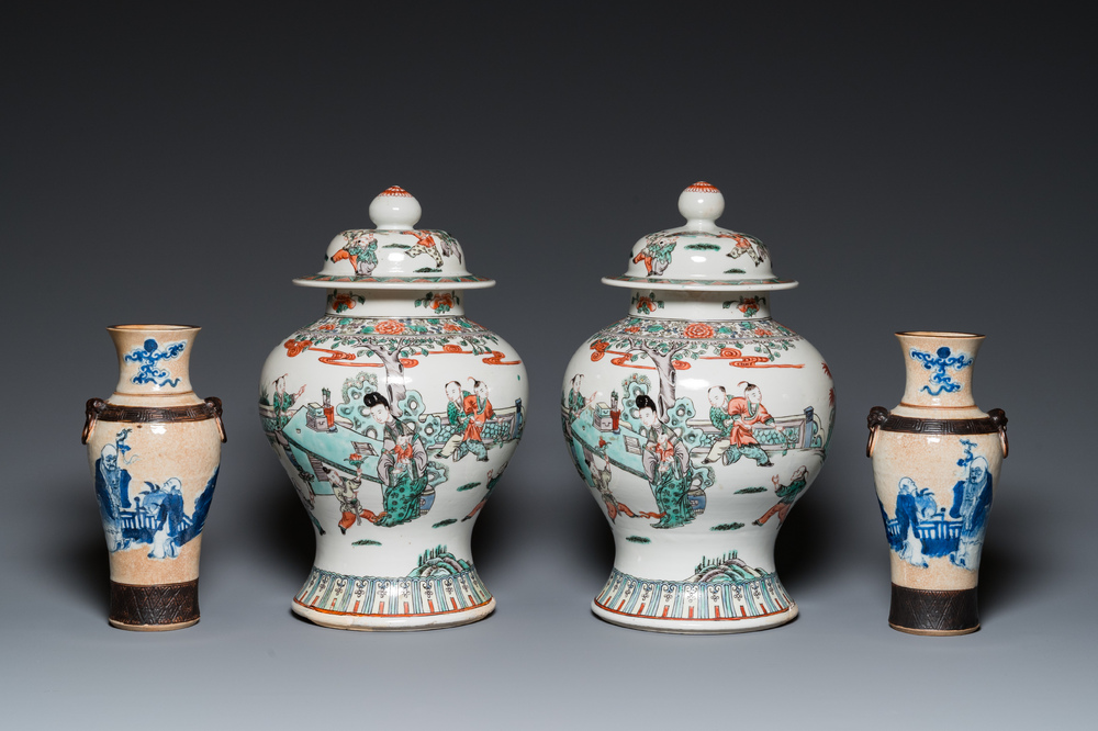 A pair of Chinese famille verte vases with covers and a pair of Nanking vases, 19th C.