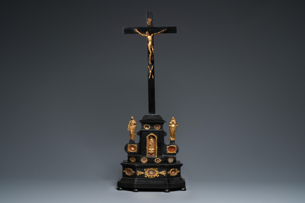 An ebonised wooden reliquary crucifix with gilt bronze corpus, Germany or Italy, 17/18th C.