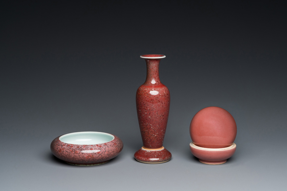 A Chinese monochrome copper-red box, a peachbloom-glazed vase on stand and a brush washer, Kangxi and Yongzheng marks, 19/20th C.