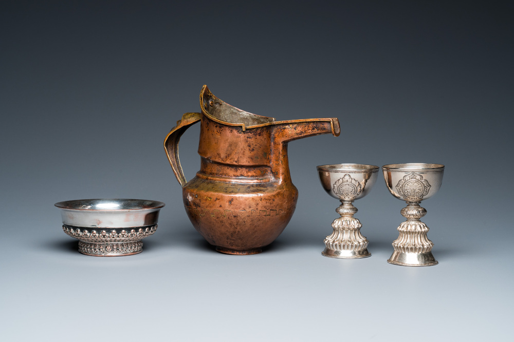 Two Tibetan silver stem bowls, a silvered bowl and a copper 'sengmaohu' ewer, 17/19th C.