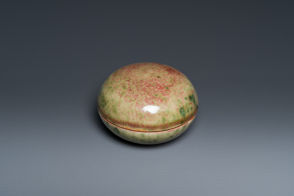 A Chinese peachbloom-glazed seal paste box, Kangxi mark, 19th C.