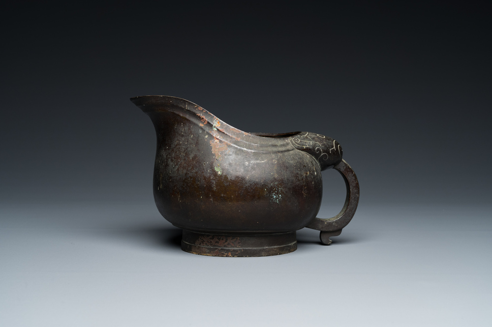 A rare Chinese inscribed archaistic bronze 'Yi' pouring vessel, Zhenghe, Northern Song