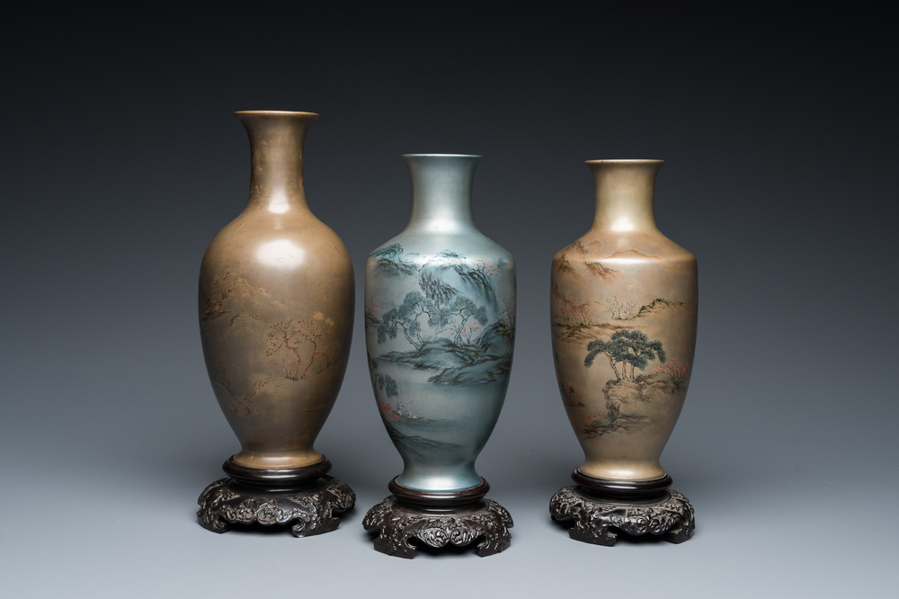 Three Chinese Fuzhou or Foochow lacquer 'landscape' vases on stands, 2nd half 20th C.