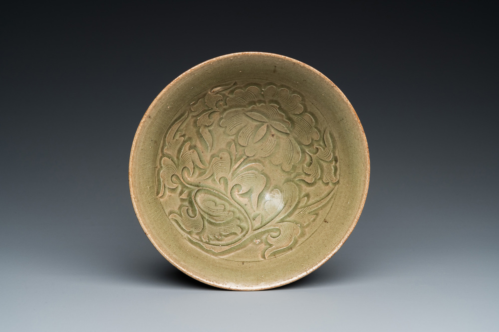 A Chinese Yaozhou celadon bowl with underglaze floral design, probably Ming