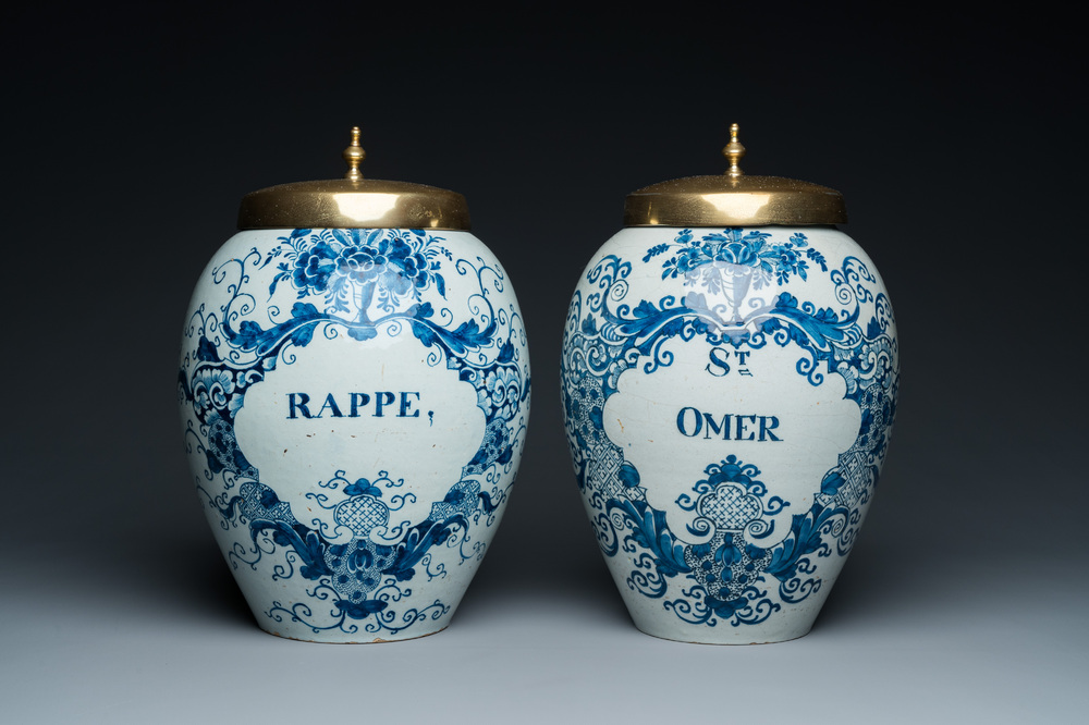 A pair of Dutch Delft blue and white tobacco jars with brass lids, 18th C.