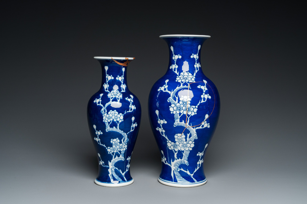 Two Chinese blue and white 'prunus' vases with kintsugi repairs, Qianlong mark, 20th C.
