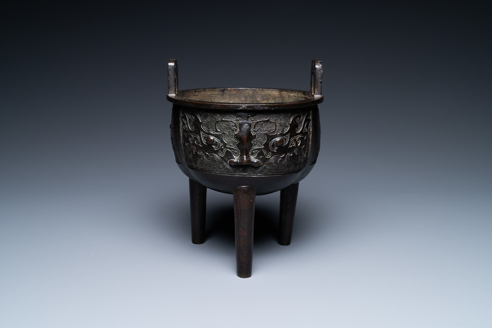 A Chinese bronze tripod censer with 'taotie' masks, Ming