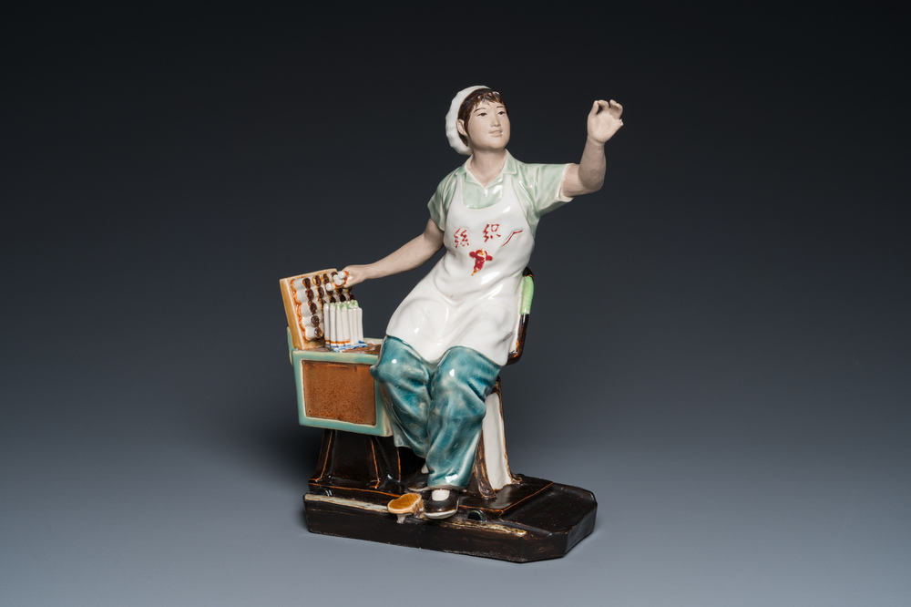 A Chinese Cultural Revolution figure of a cotton weaver, ca. 1970