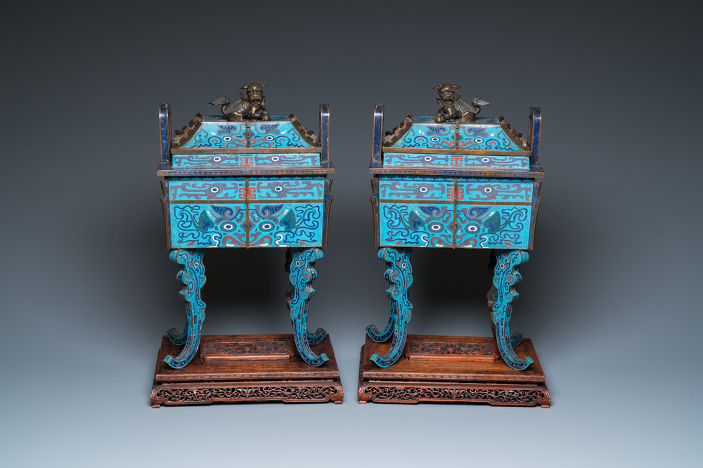 A pair of large Chinese cloisonn&eacute; 'fangding' censers and covers on wooden stands, 19th C.