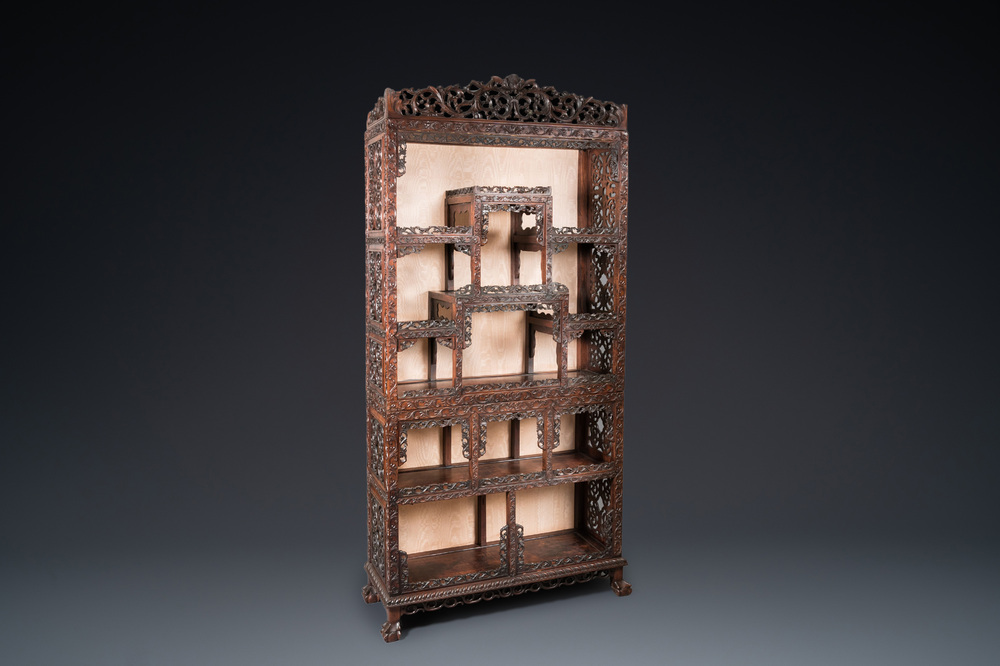 A Chinese reticulated hardwood display cabinet, 19th C.
