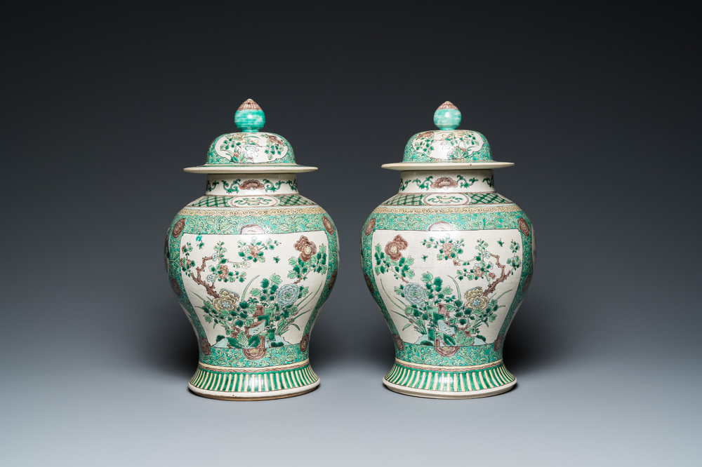 A pair of Chinese verte biscuit vases and covers, 19th C.