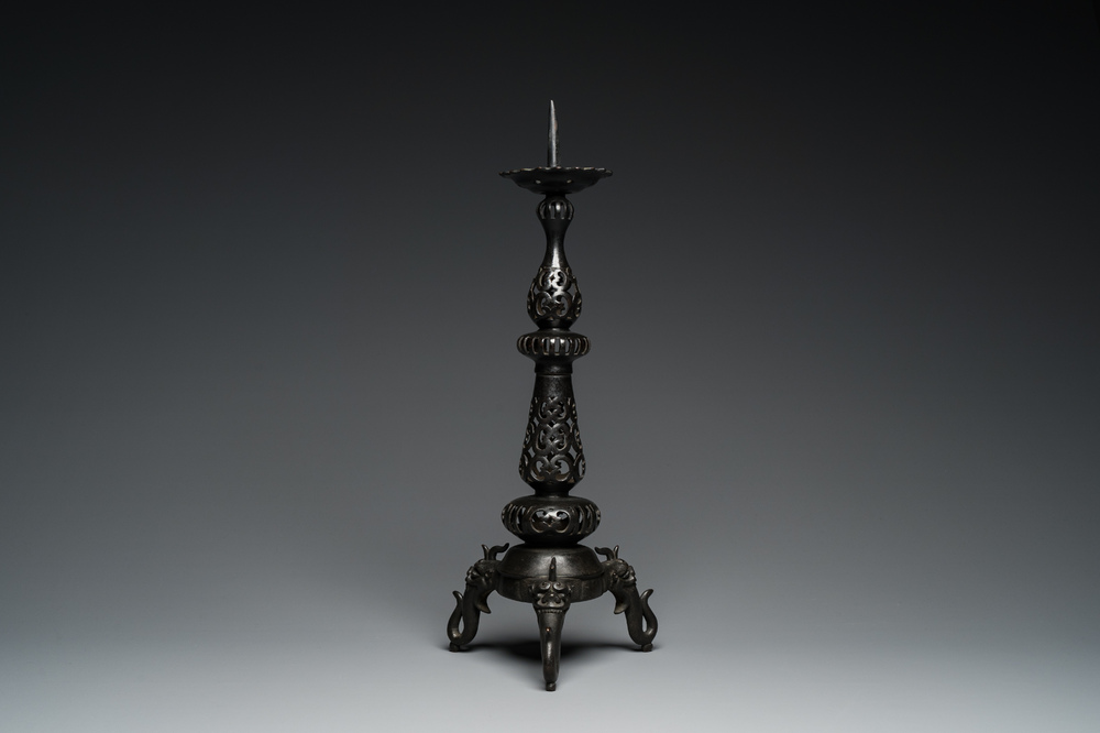 A large Chinese bronze reticulated candle holder, 17th C.