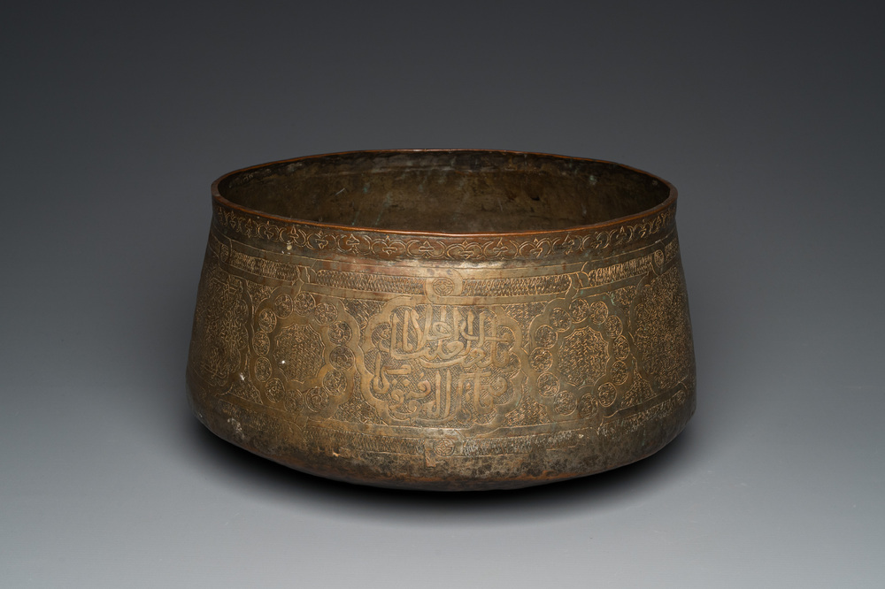 A large Islamic engraved bronze basin with calligraphic design, probably Egypt, 18/19th C.