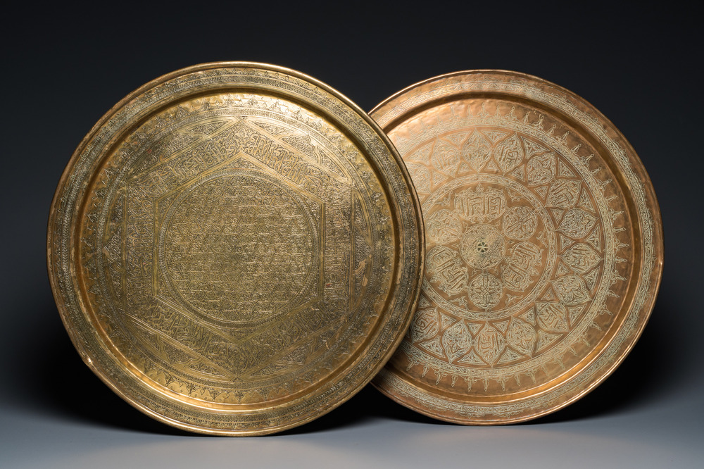 Two large Islamic Mamluk-style brass dishes, Egypt or Syria, 19th C.