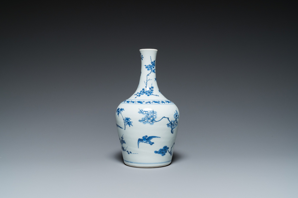 A Chinese blue and white bottle vase with birds among blossoms, Transitional period