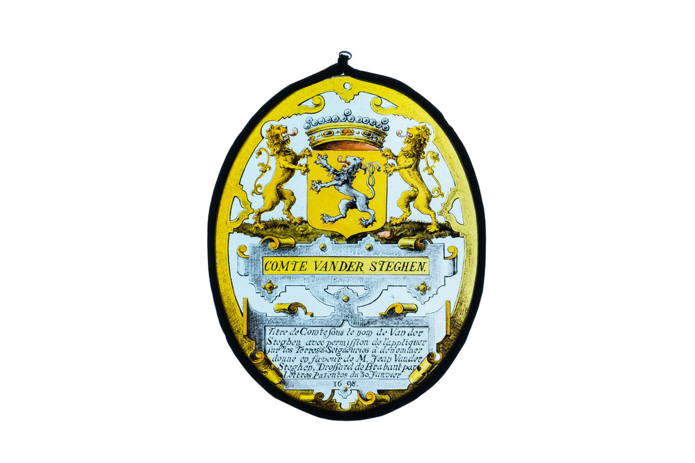 An armorial painted glass medallion inscribed 'Comte van der Steghen', dated 1698