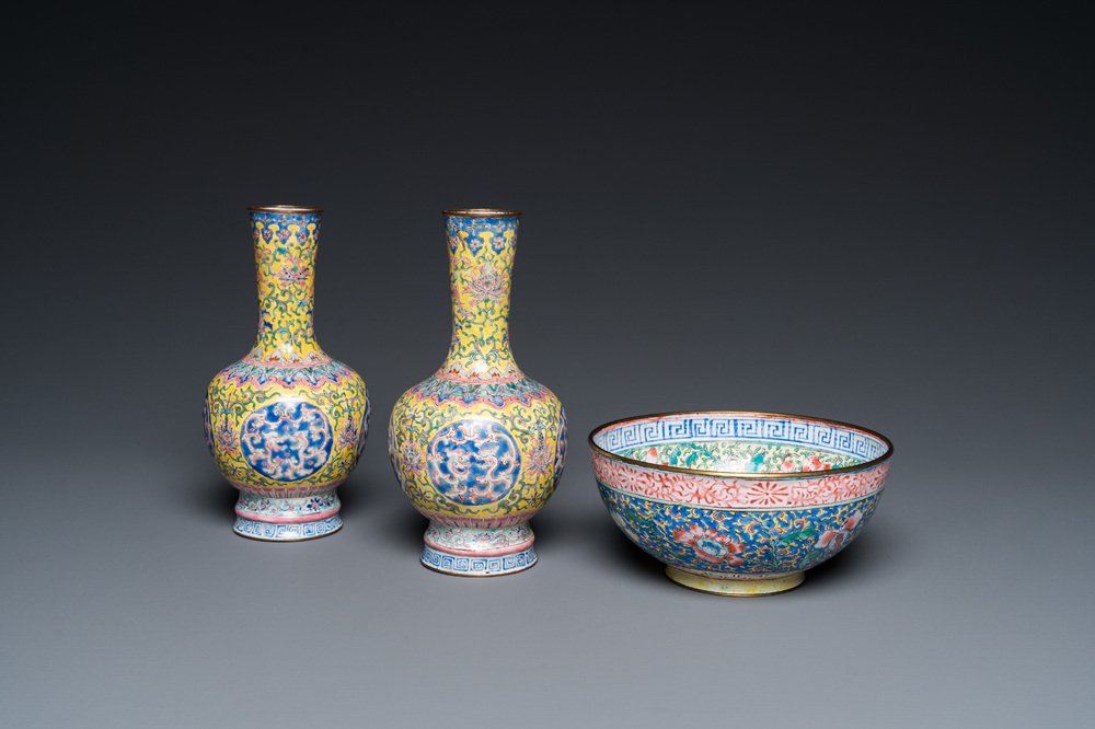 A pair of Chinese yellow-ground Canton enamel vases and a bowl, Yongzheng/Qianlong