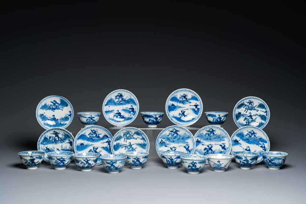 13 Chinese blue and white 'rabbit hunt' cups and 10 saucers, Qianlong mark, 19th C.