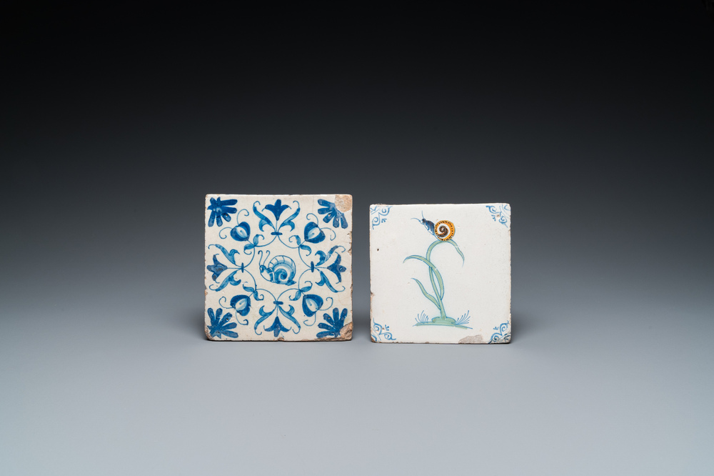 A polychrome Dutch Delft tile with a snail on a plant and a blue and white one with a snail in an ornament, 17th C.