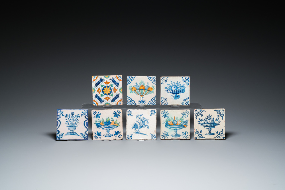 Eight Dutch Delft blue and white and polychrome tiles, 17th C.