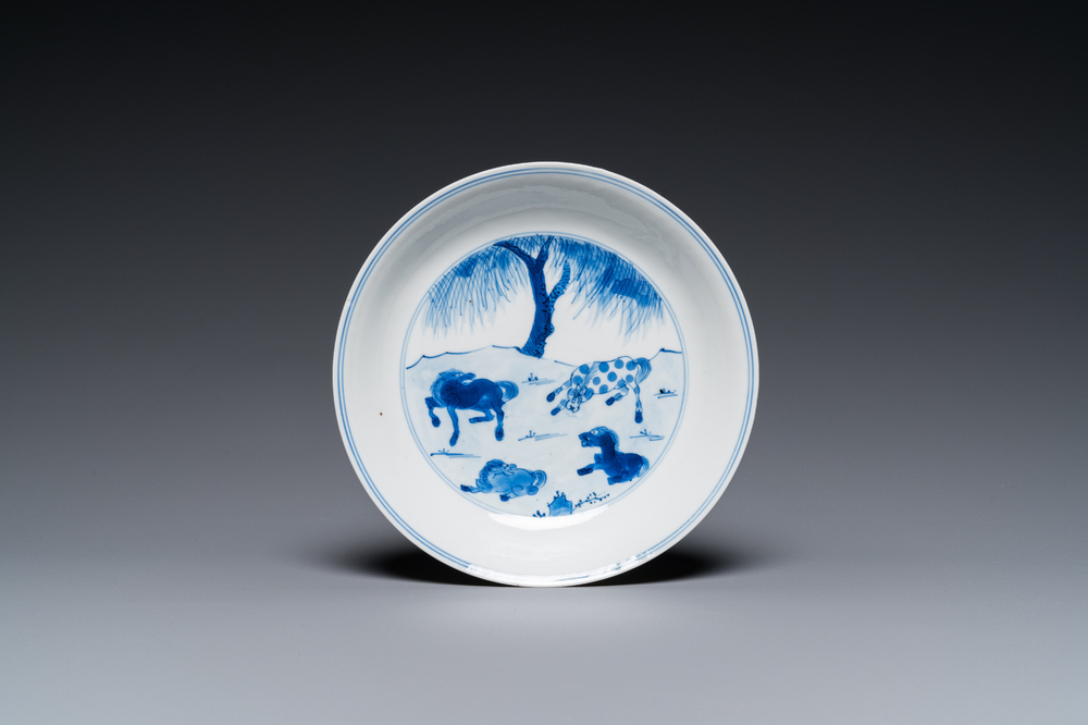 A Chinese blue and white 'Horses of Mu Wang' plate, Kangxi mark and of the period