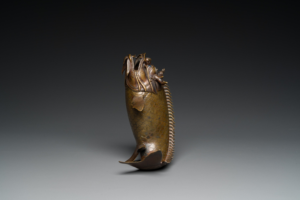 A Chinese bronze dragonfish form censer, Ming