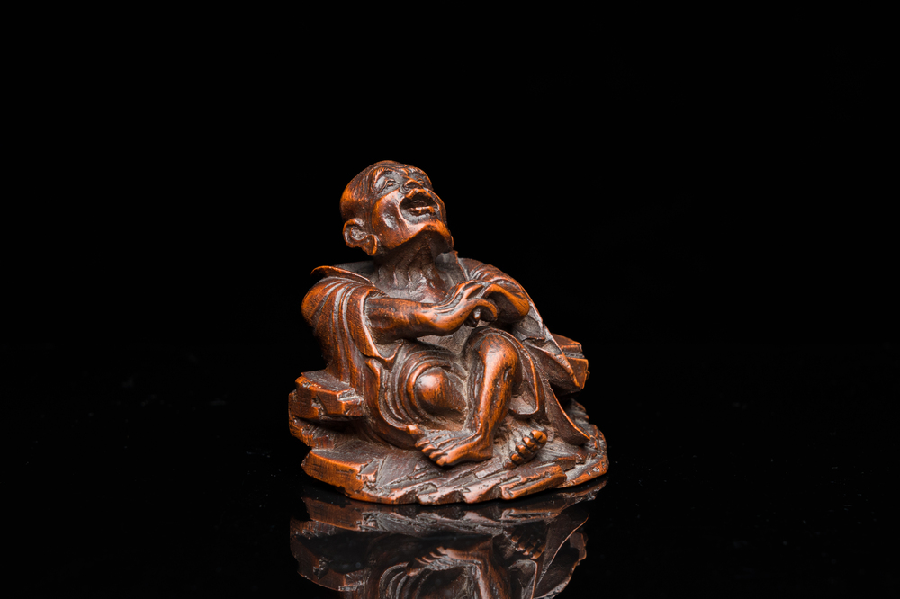 A Chinese bamboo carving of a laughing Luohan, 18th C.