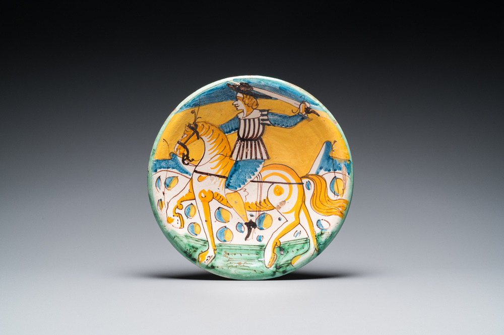 A polychrome Italian maiolica dish with a horserider, Montelupo, 17th C.