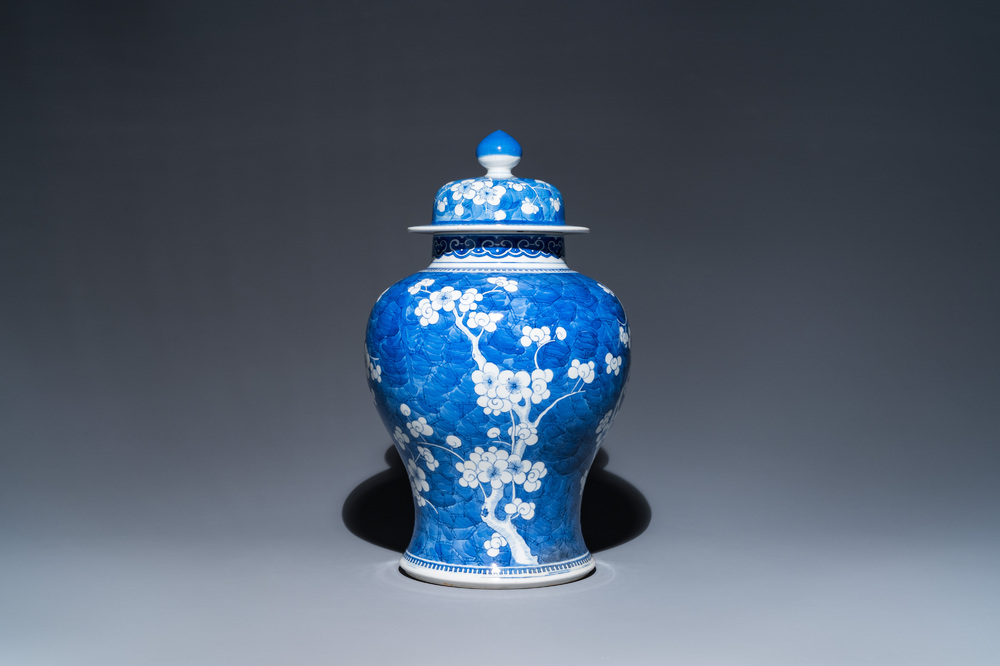 A Chinese blue and white 'prunus on cracked ice' vase and cover, Kangxi