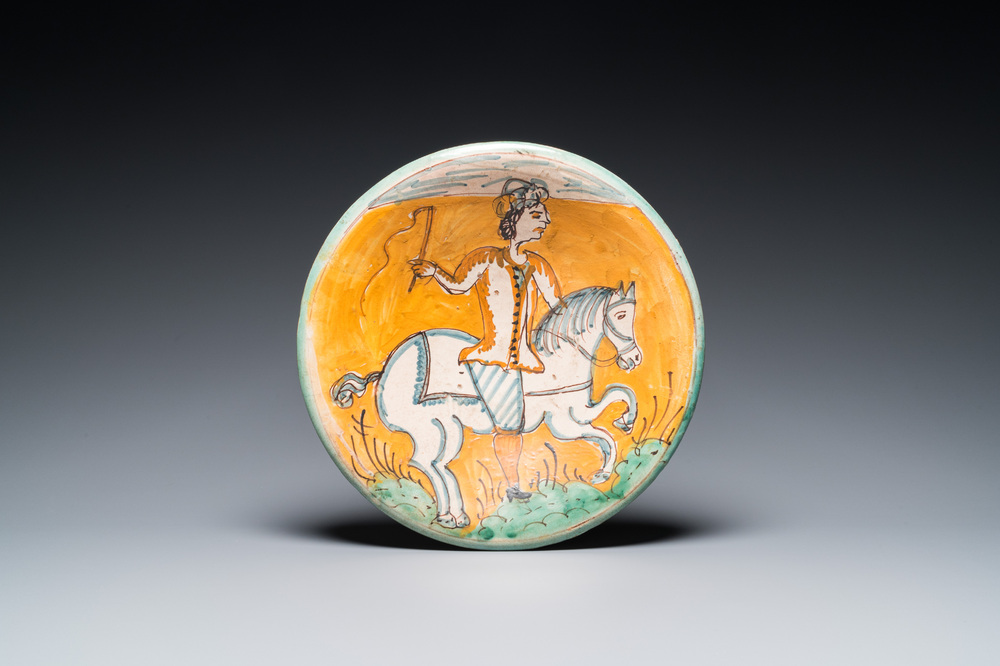 A polychrome Italian maiolica dish with a horserider, Montelupo, 17th C.