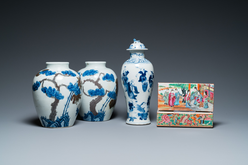 A pair of Chinese blue, white and copper-red vases, a blue and white covered vase and a Canton famille rose box and cover, 19/20th C.