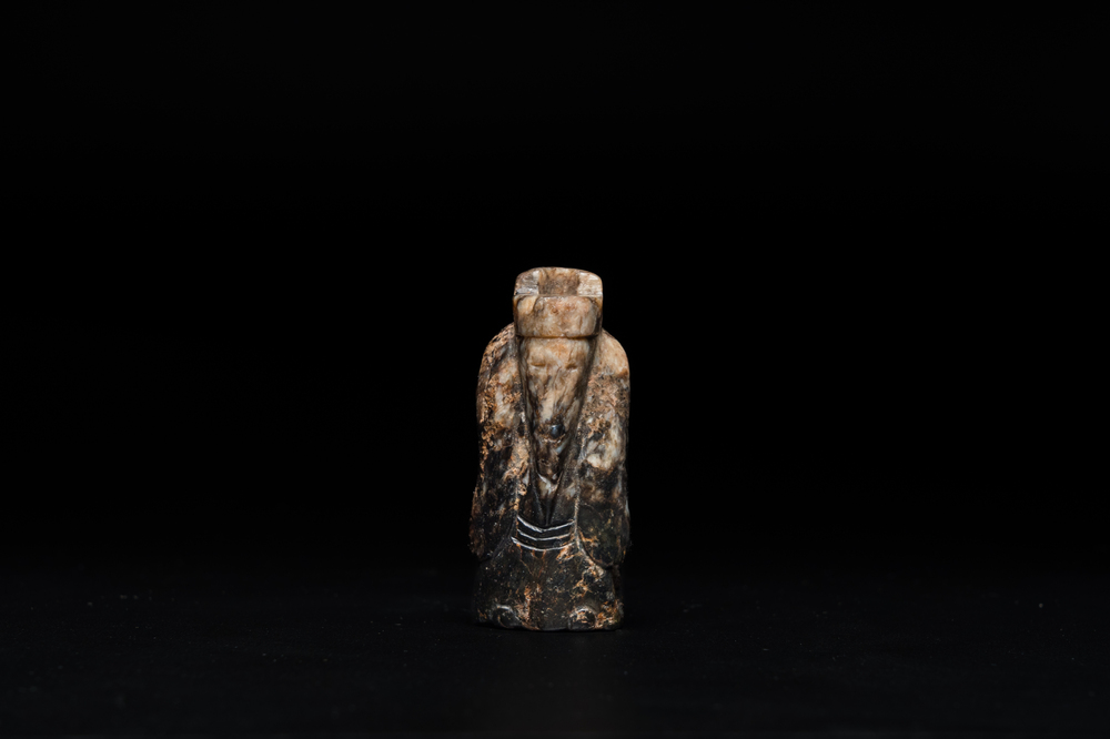 A Chinese black and grey jade figural pendant, Han Dynasty