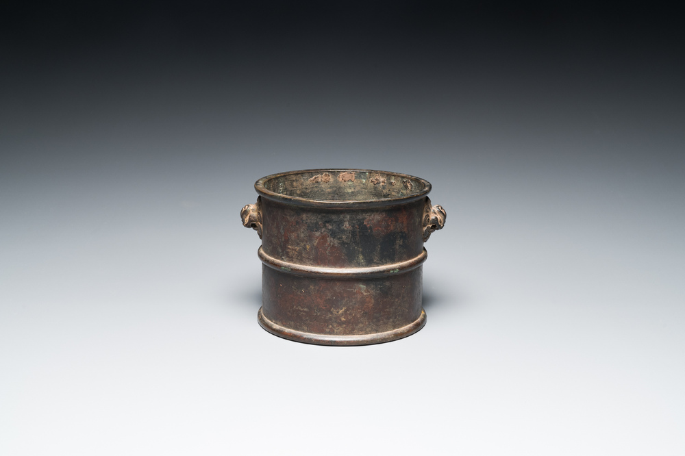 A Chinese bronze censer with mythical beast head handles, Xuande mark, Kangxi