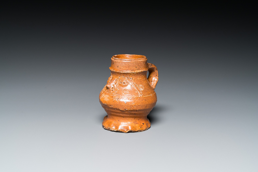 A stoneware 'pointy nose face' jug, probably Raeren, 15/16th C.