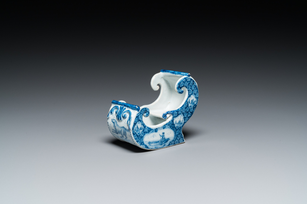 A Dutch Delft blue and white pipe stand in the shape of a sleigh, 18th C.