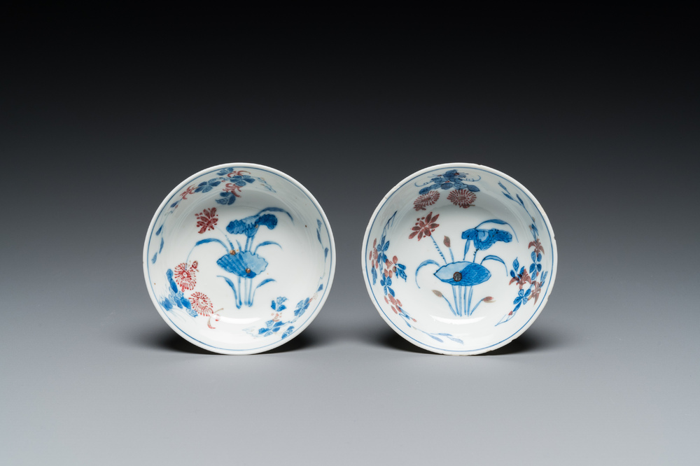 A pair of Chinese blue, white and copper-red semi-eggshell bowls, Xuande mark, Wanli