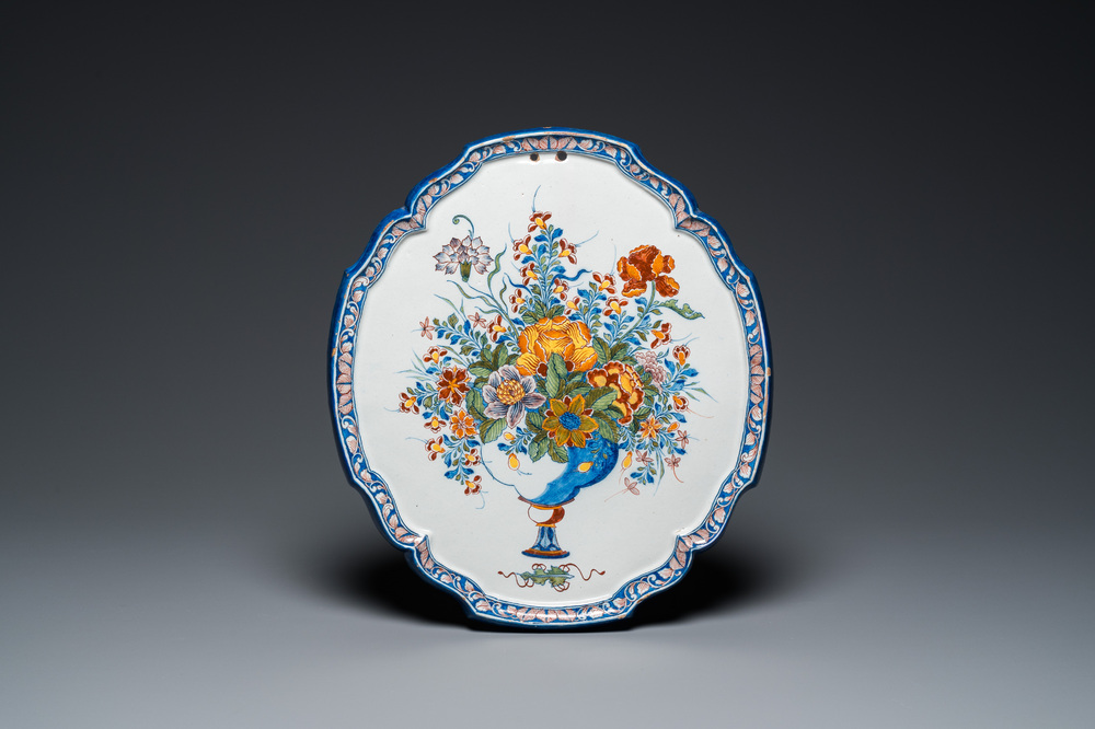 A fine polychrome Dutch Delft 'flower vase' plaque, 18th C.