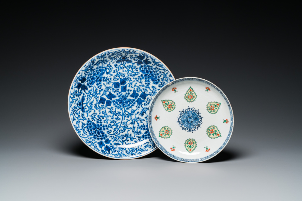 A Chinese blue and white 'peony scroll' dish and a famille verte dish, Kangxi