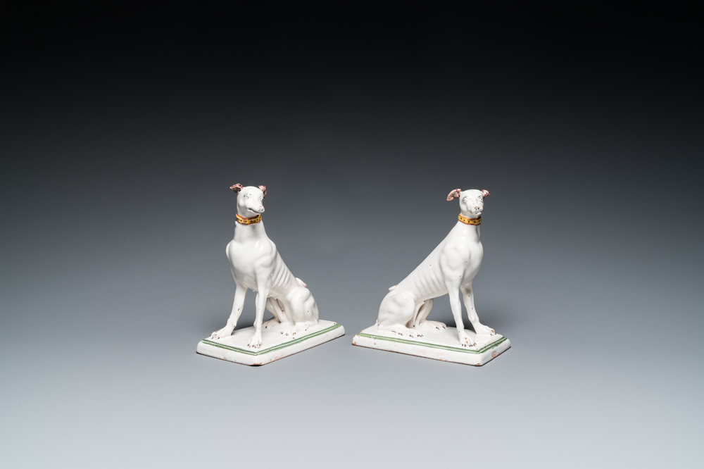 A pair of polychrome Brussels faience greyhounds, 18th C.