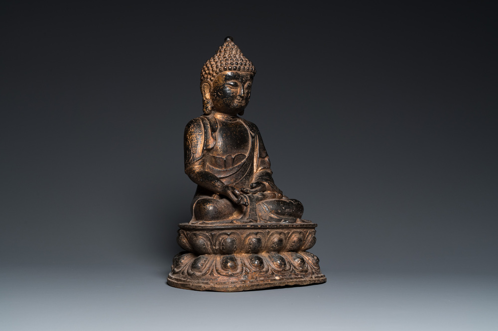 A large Chinese bronze Buddha with traces of gilding, Kangxi mark, Qing